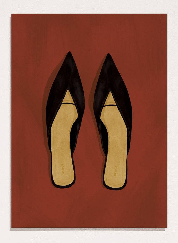 A pair of black pointed-toe flat mules with a contrasting beige insole, displayed flat against a solid reddish-brown background. Chic Black Mules by Lisa Solomoniuk premium framed fine art print featuring pointed black shoes with golden insoles against a rich rust red background.