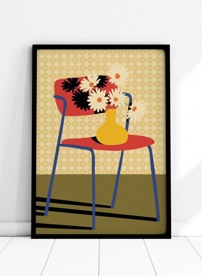 A stylized art print depicting a blue chair with a red seat and backrest, holding a yellow vase filled with white daisies, set against a patterned beige wallpaper and olive green floor. Colorful Chair Still Life by Lisa Solomoniuk premium framed fine art print featuring a red chair, yellow vase, white flowers, and bold graphic color.
