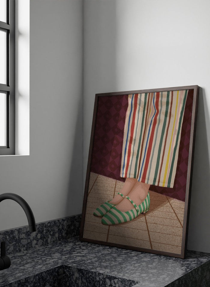 A close-up of a person's feet wearing green and white striped Mary Jane flats, paired with cream-colored striped trousers, standing on a tiled floor against a dark patterned wall. Colorful Striped Mary Janes by Lisa Solomoniuk premium framed fine art print featuring green striped shoes and colorful wide-leg trousers.