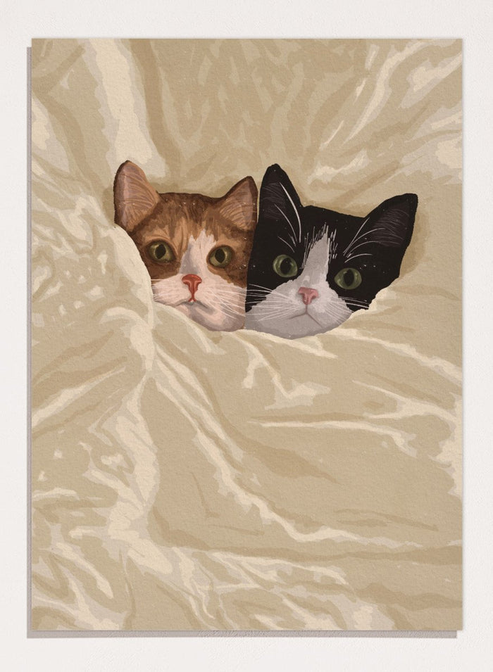 A stylized illustration of two cats peeking out from under a rumpled cream-colored blanket. The cat on the left is orange and white, and the cat on the right is black and white.  Cozy Cats Peeking Out by Lisa Solomoniuk premium framed fine art print featuring two cats tucked into soft cream bedding with wide-eyed expressions.