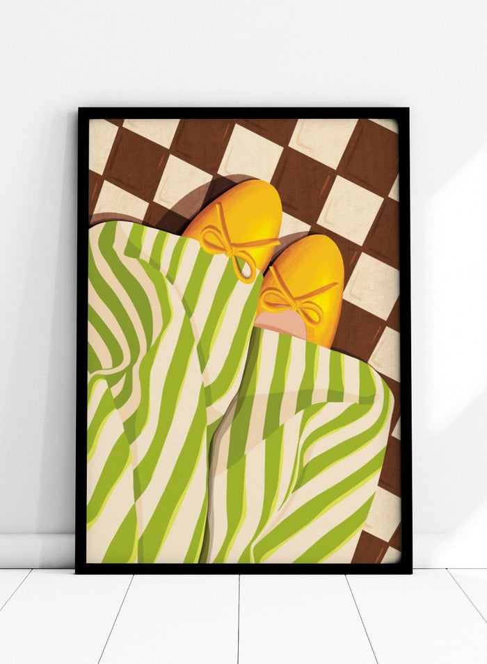 A stylized illustration of a person wearing green and white striped pajama pants and yellow slip-on shoes with bow details, lying on a brown and cream checkered floor. Cozy Striped Feet by Lisa Solomoniuk premium framed fine art print featuring yellow slippers, green striped trousers, and a bold checkered floor.