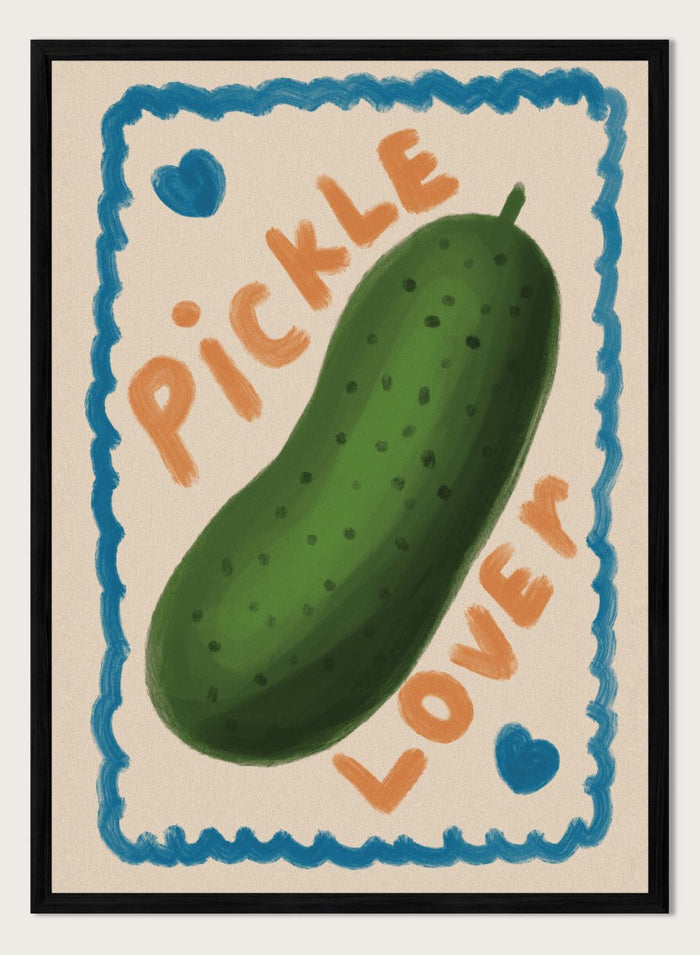 An art print featuring a hand-drawn green pickle centered on a cream background, surrounded by a blue scalloped border. The words 'PICKLE' and 'LOVER' appear in orange lettering, with two small blue hearts near the corners. Cute Pickle Lover by Lisa Solomoniuk premium framed fine art print featuring a giant green pickle, playful lettering, blue hearts, and a hand-painted border.