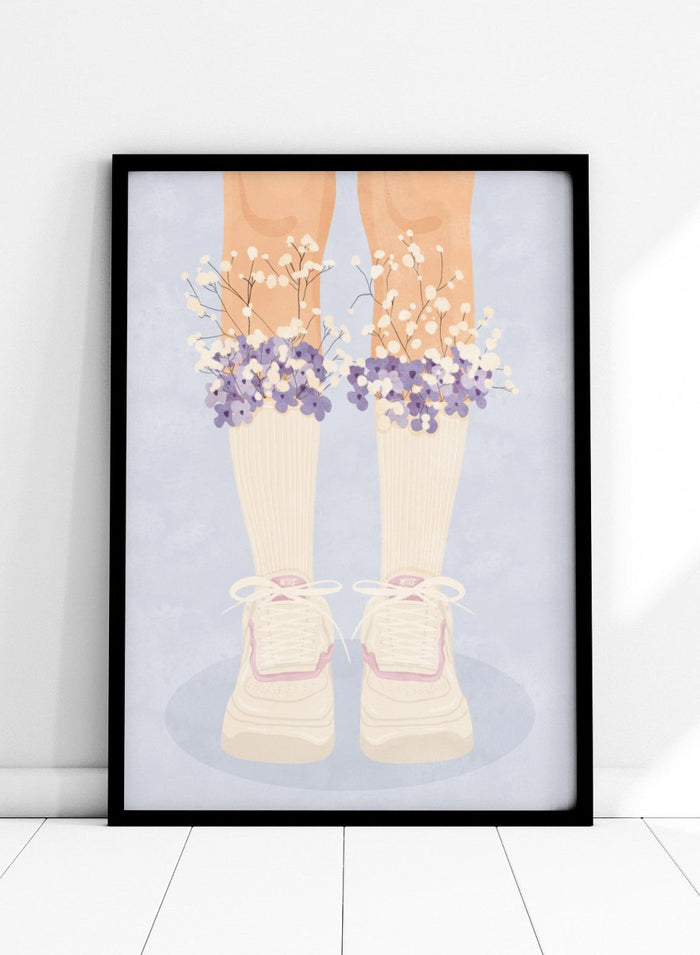 A stylized illustration of a person's legs wearing cream ribbed socks, white sneakers with pink trim, and bunches of small white and purple flowers at the top of the socks, set against a pale blue background. Floral Socks and Sneakers by Lisa Solomoniuk premium framed fine art print featuring cream sneakers with purple and white flowers.