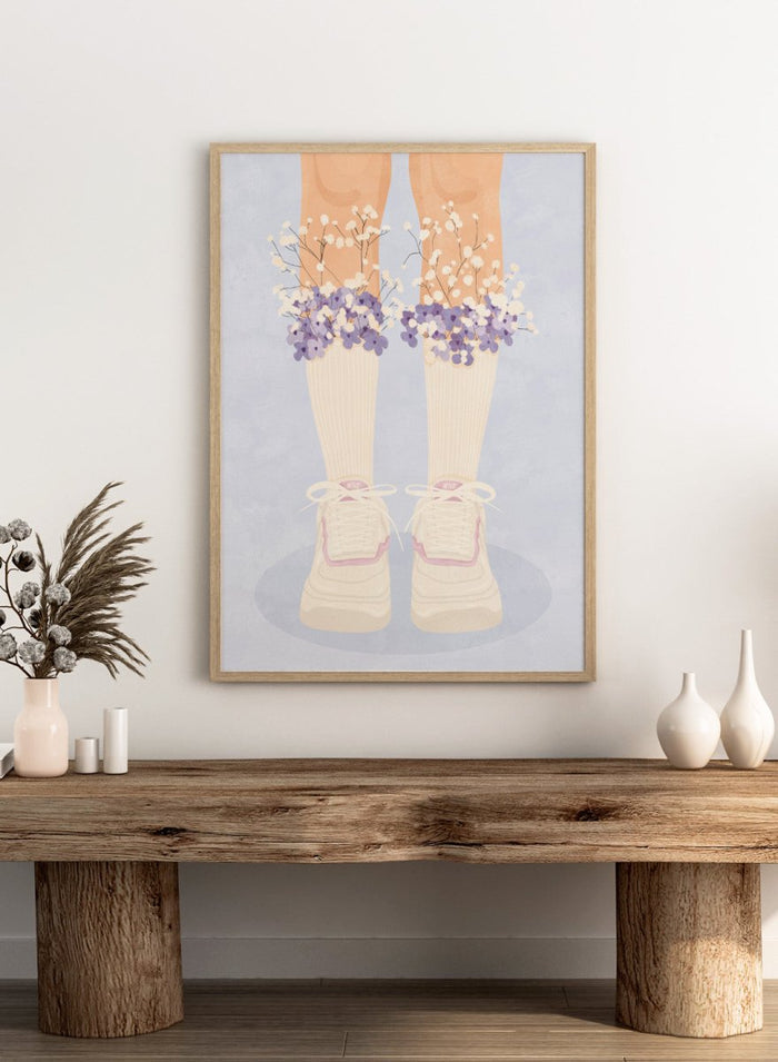A stylized illustration of a person's legs wearing cream ribbed socks, white sneakers with pink trim, and bunches of small white and purple flowers at the top of the socks, set against a pale blue background. Floral Socks and Sneakers by Lisa Solomoniuk premium framed fine art print featuring cream sneakers with purple and white flowers.