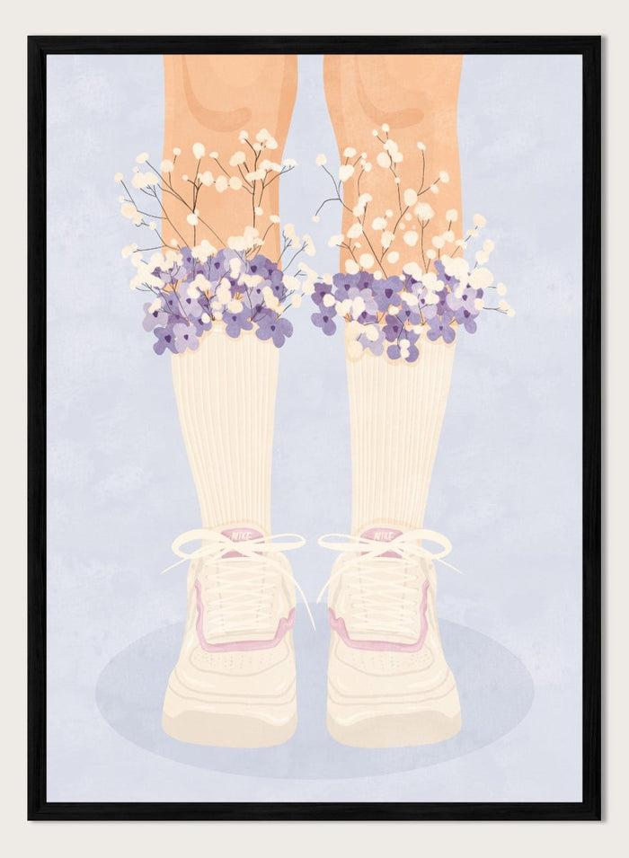 A stylized illustration of a person's legs wearing cream ribbed socks, white sneakers with pink trim, and bunches of small white and purple flowers at the top of the socks, set against a pale blue background. Floral Socks and Sneakers by Lisa Solomoniuk premium framed fine art print featuring cream sneakers with purple and white flowers.