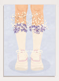 A stylized illustration of a person's legs wearing cream ribbed socks, white sneakers with pink trim, and bunches of small white and purple flowers at the top of the socks, set against a pale blue background. Floral Socks and Sneakers by Lisa Solomoniuk premium framed fine art print featuring cream sneakers with purple and white flowers.