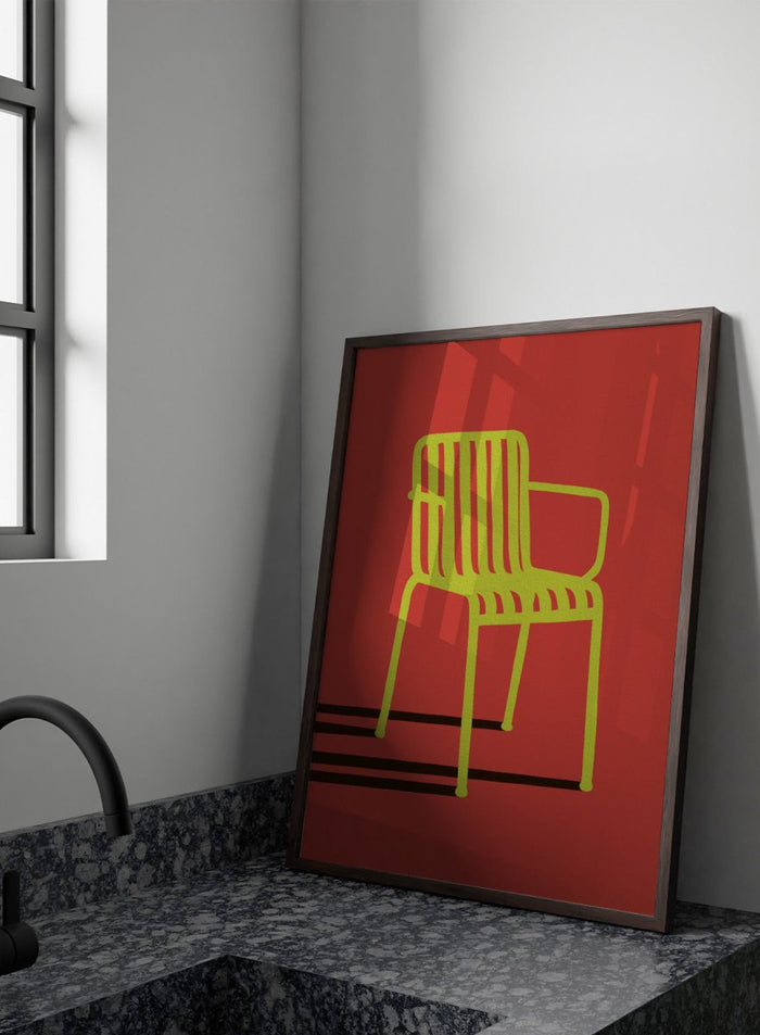 A minimalist graphic art print of a modern armchair, featuring a lime green chair silhouette on a solid red background with bold black shadows. Green Chair Shadow by Lisa Solomoniuk premium framed fine art print featuring a bright green chair and long black shadow against a deep red background.