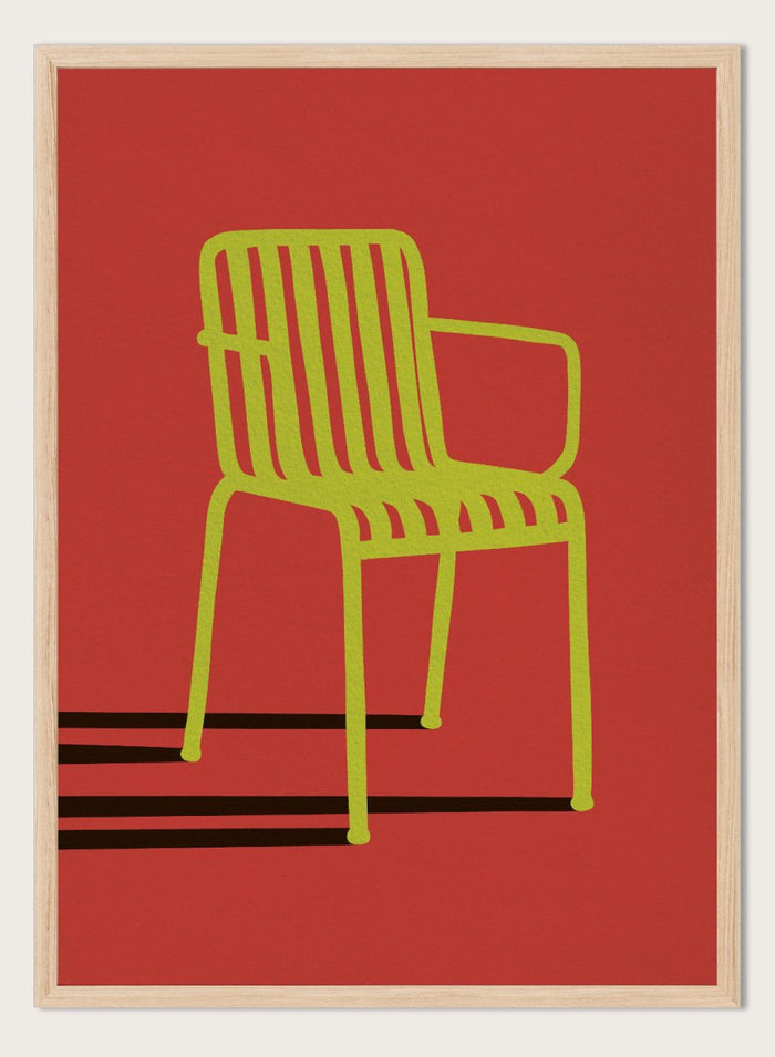 A minimalist graphic art print of a modern armchair, featuring a lime green chair silhouette on a solid red background with bold black shadows. Green Chair Shadow by Lisa Solomoniuk premium framed fine art print featuring a bright green chair and long black shadow against a deep red background.