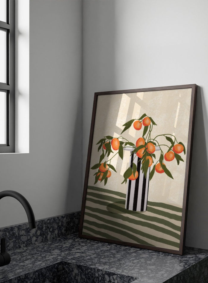 A stylized still life illustration of orange branches with green leaves and ripe oranges arranged in a black-and-white striped vase on a striped surface against a warm cream background. Orange Branches Vase by Lisa Solomoniuk premium framed fine art print featuring bright orange fruit, green leaves, and a striped black-and-white vase.