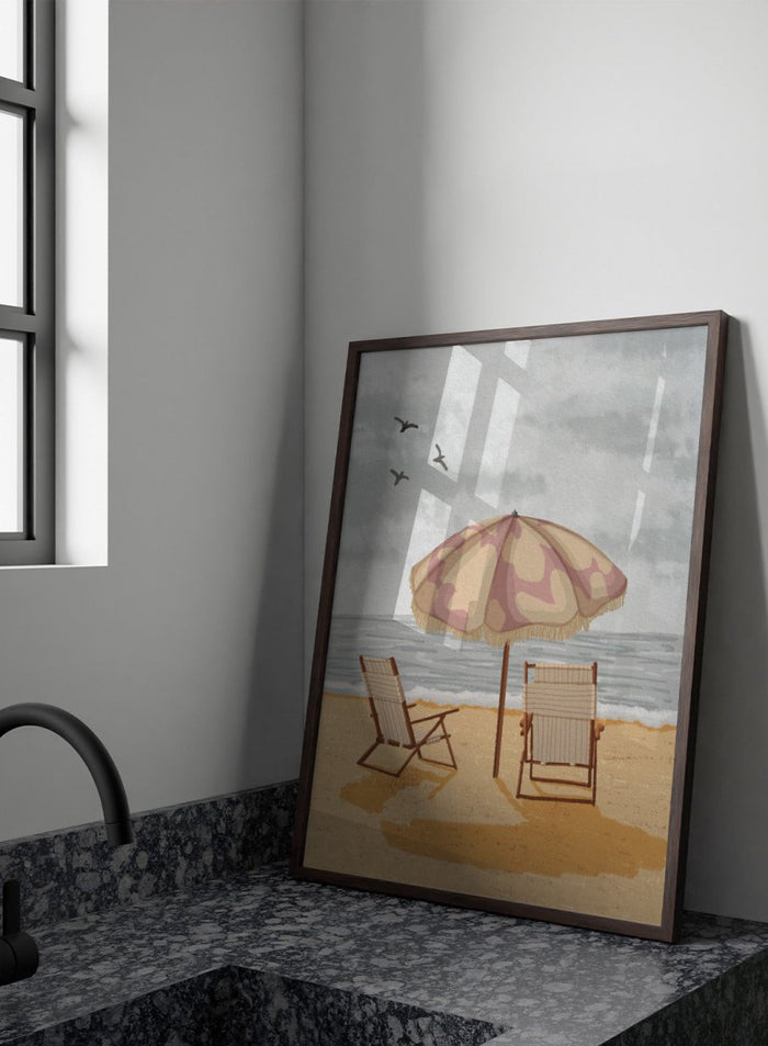 A beach scene artwork showing two wooden deck chairs under a beige and dusty pink patterned umbrella on a sandy shore, with the ocean and cloudy sky behind them. Two birds are visible in the sky. Seaside Umbrella Chairs by Lisa Solomoniuk premium framed fine art print featuring striped beach chairs beneath a fringed umbrella by the sea.