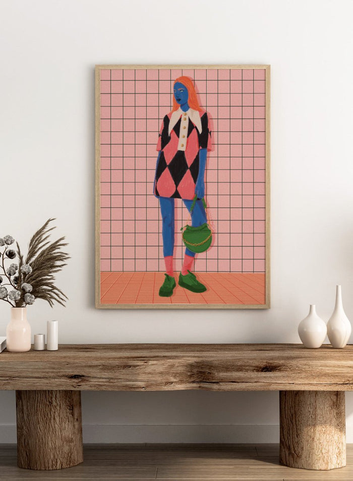 A stylized fashion illustration of a person with blue skin and orange hair, wearing a pink and black harlequin dress with a white collar, blue leggings, green shoes, and carrying a green bag, set against a pink grid background. Vibrant Argyle Style by Lisa Solomoniuk premium framed fine art print featuring a bold fashion figure in bright pink, blue, green, and black.