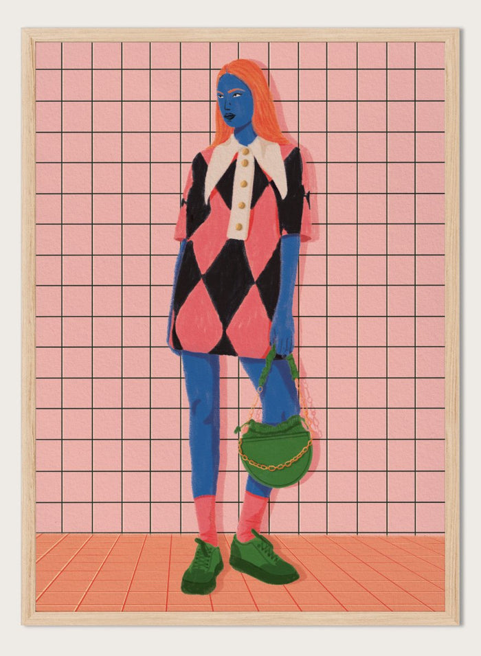 A stylized fashion illustration of a person with blue skin and orange hair, wearing a pink and black harlequin dress with a white collar, blue leggings, green shoes, and carrying a green bag, set against a pink grid background. Vibrant Argyle Style by Lisa Solomoniuk premium framed fine art print featuring a bold fashion figure in bright pink, blue, green, and black.