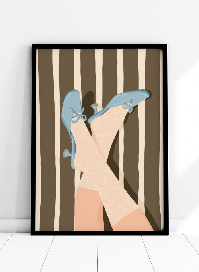 A stylized illustration of crossed legs wearing beige patterned socks and light blue kitten-heel flats with bow details, set against a brown and cream striped background. Whimsical Blue Heels by Lisa Solomoniuk premium framed fine art print featuring pale blue heels, patterned tights, and bold brown stripes.