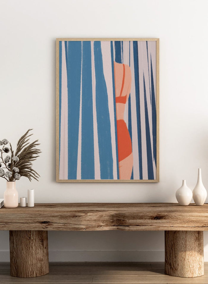 A stylized art print featuring a woman in an orange bikini partially obscured by vertical blue and white striped curtains. Woman Behind Stripes by Lisa Solomoniuk premium framed fine art print featuring a woman in a red bikini behind bold blue-and-white coastal stripes.