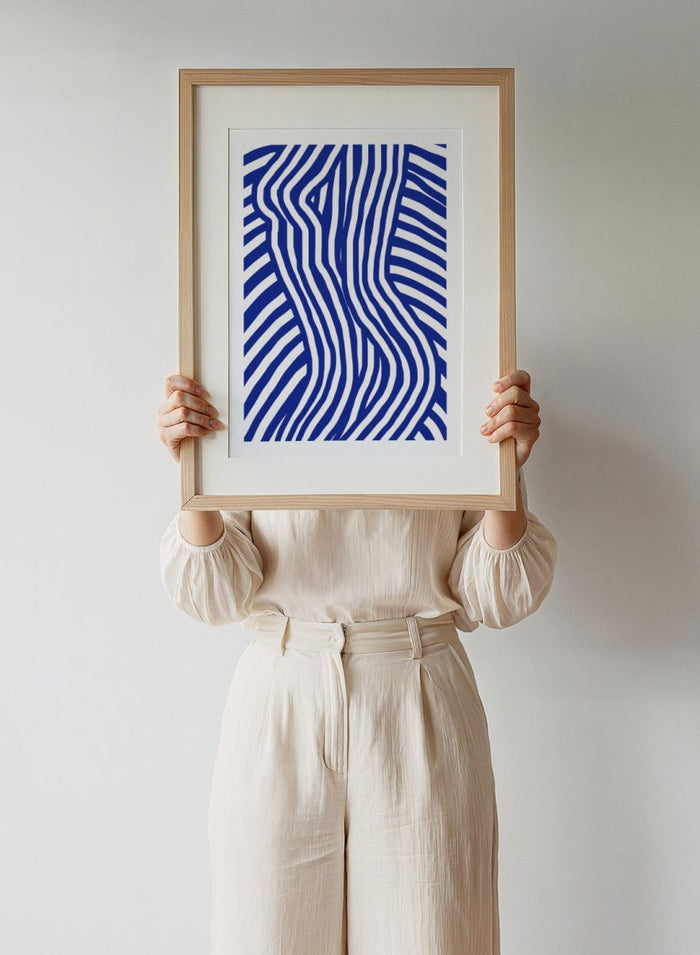 Blue and white wavy pattern on a white background. Blue and White Striped by Little Dean abstract optical illusion art print featuring striped silhouette, modern graphic pattern illustration wall art poster.