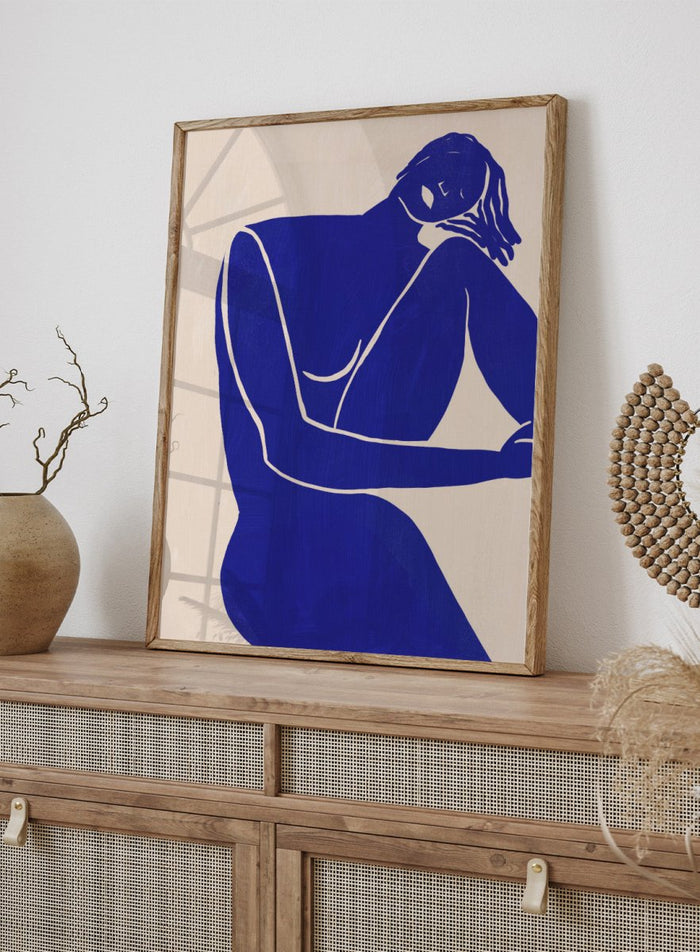 Blue line art of a woman figure on a beige background. Minimalist Blue Silhouette Figure by Little Dean modern abstract figure art print featuring bold blue female silhouette, contemporary minimalist wall art poster.