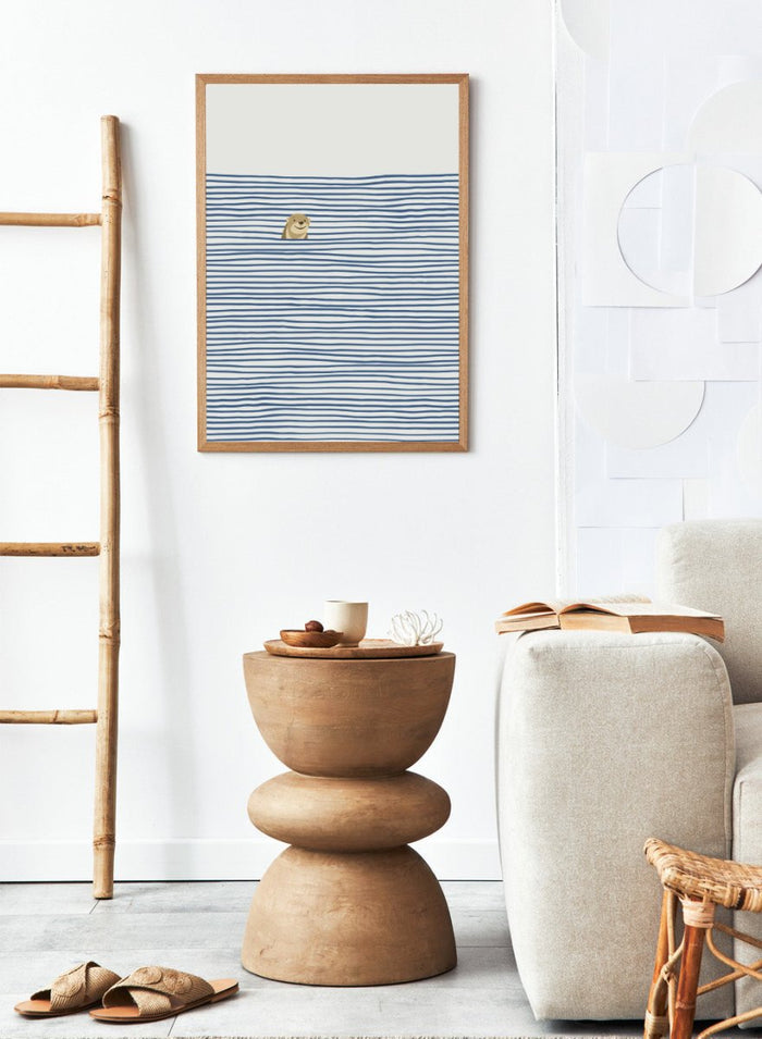 Otter in the Waves art print by Little Dean. Playful contemporary wall art featuring a smiling otter, blue wave pattern, minimalist illustration, and modern poster design.