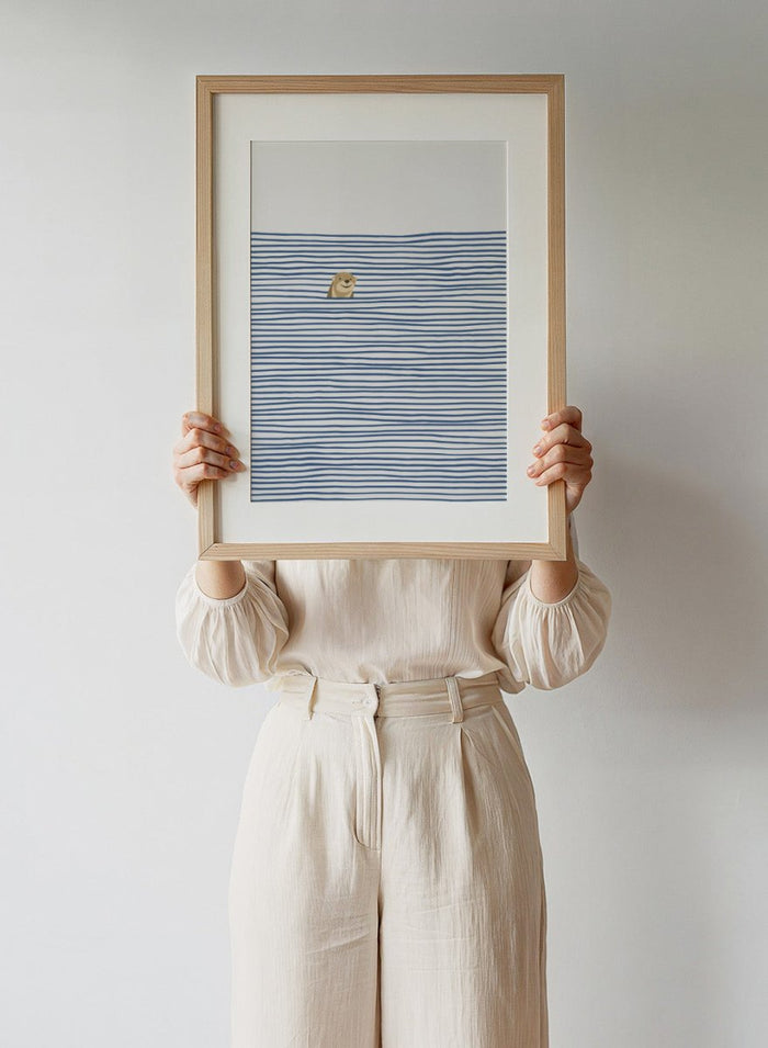 Otter in the Waves art print by Little Dean. Playful contemporary wall art featuring a smiling otter, blue wave pattern, minimalist illustration, and modern poster design.