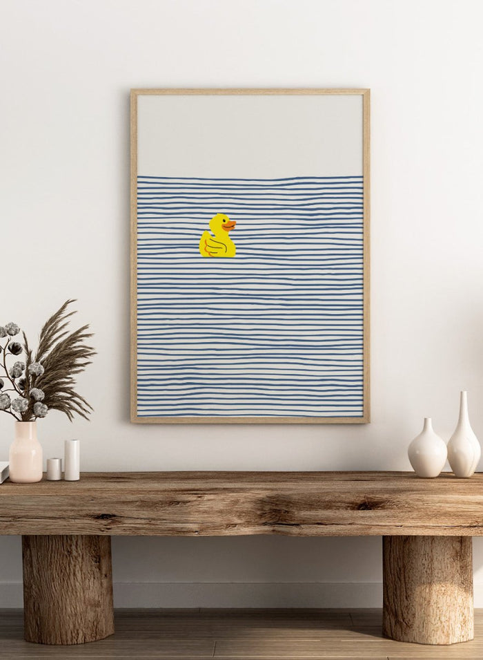 Yellow Duck Afloat art print by Little Dean. Playful duck illustration with blue ocean stripes, modern minimalist wall art, contemporary poster design.
