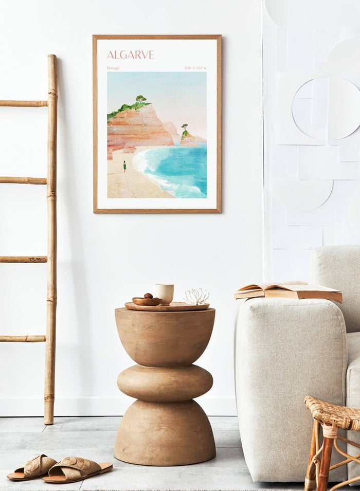 Illustration of a beach scene with cliffs and a person standing on the shore, labeled 'Algarve, Portugal'. Algarve Coastal Walk by Longwayhome is a minimalist coastal landscape art print featuring Portugal cliffs, turquoise ocean scenery, and modern travel inspired design.