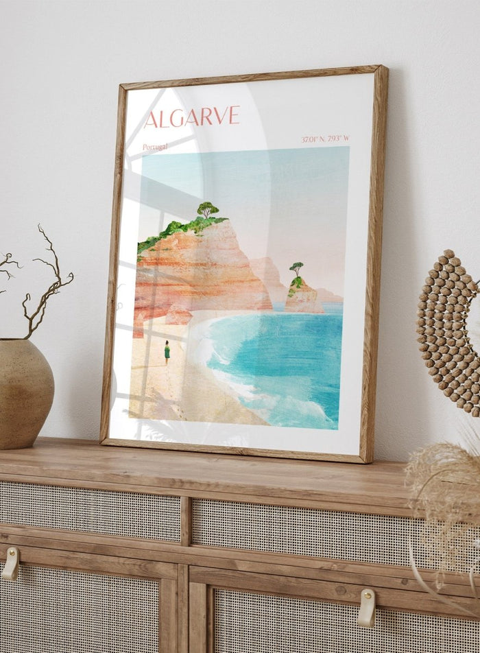 Illustration of a beach scene with cliffs and a person standing on the shore, labeled 'Algarve, Portugal'. Algarve Coastal Walk by Longwayhome is a minimalist coastal landscape art print featuring Portugal cliffs, turquoise ocean scenery, and modern travel inspired design.