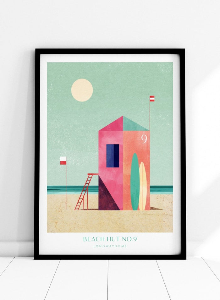 Colorful beach hut illustration with a minimalistic design on a light green background. Beach Hut Number Nine by Longwayhome is a retro inspired coastal art print featuring a colorful beach hut, surfboards, and minimalist seaside design.