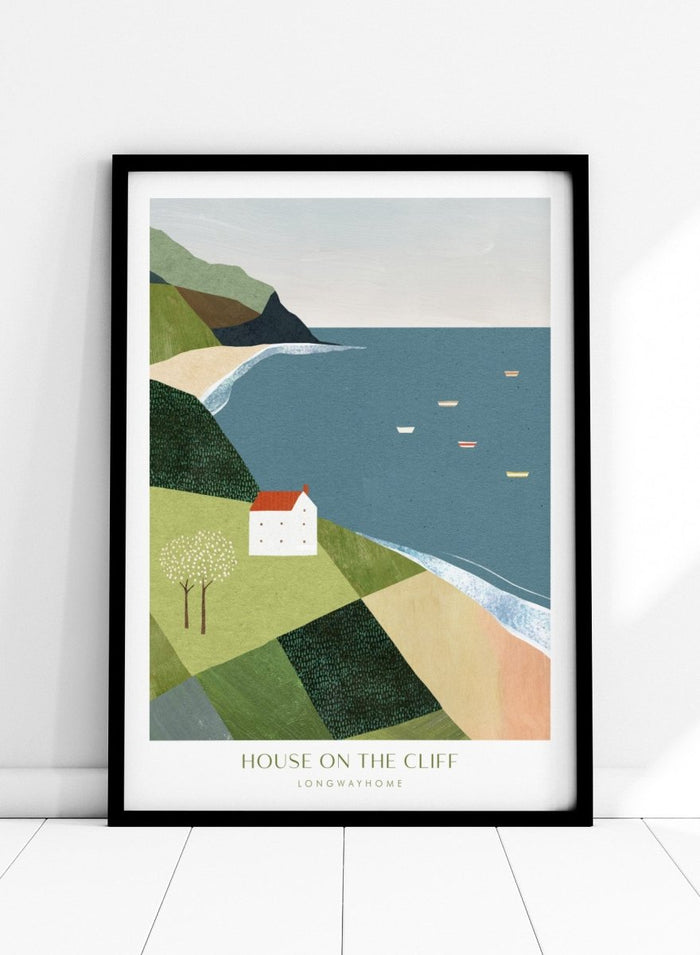 Illustration of a house on a cliff overlooking a coastal scene with boats. House on the Cliff by Longwayhome is a minimalist coastal landscape art print featuring ocean views, cliffside scenery, and modern travel inspired wall art.
