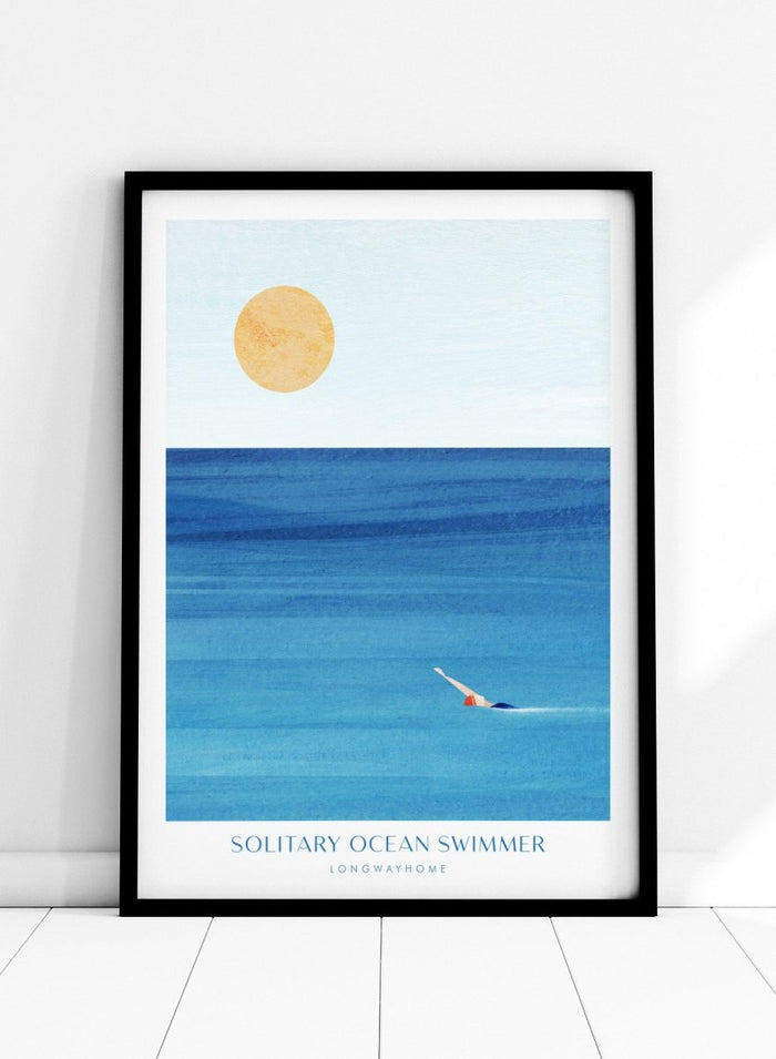 Art print of a solitary ocean swimmer with a large sun in the sky. Solitary Ocean Swimmer by Longwayhome is a minimalist ocean art print featuring deep blue water, lone swimmer imagery, and calming coastal wall art.