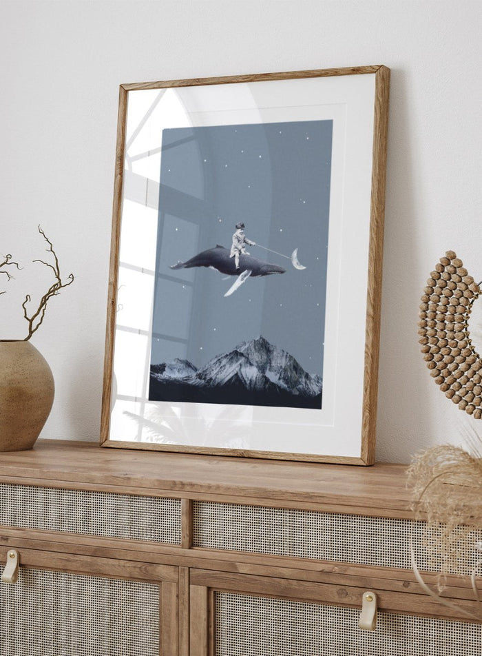Aim for the Moon by Maarten Léon is a surreal collage art print featuring a boy riding a whale in a starry sky with mountains and moon imagery.