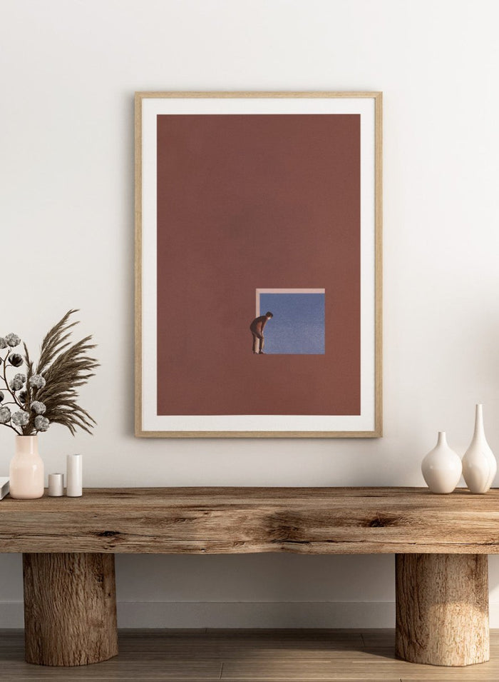 Curiosity by Maarten Léon is a minimalist collage art print showing a figure peering into a blue opening, exploring themes of curiosity and quiet discovery.