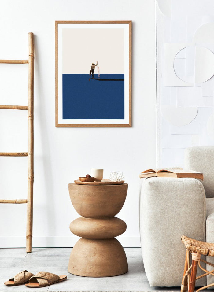 Fishing for Compliments by Maarten Léon is a minimalist collage art print featuring a fisherman at sea. Premium fine art print with real wood frame options.