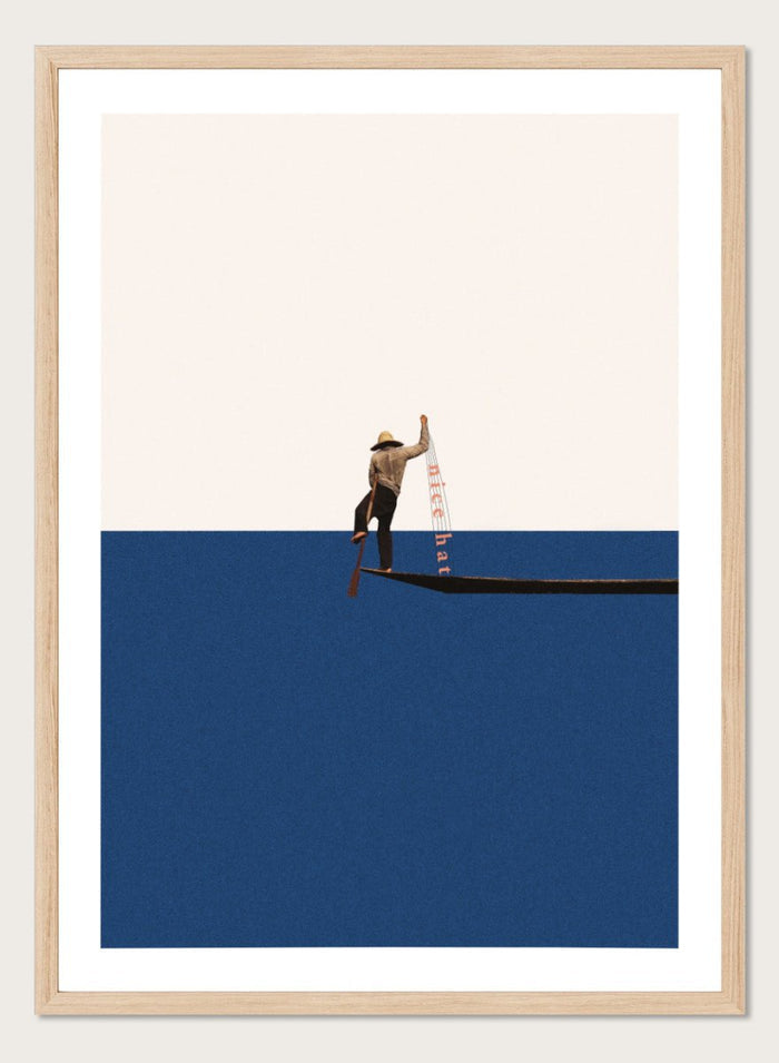 Fishing for Compliments by Maarten Léon is a minimalist collage art print featuring a fisherman at sea. Premium fine art print with real wood frame options.