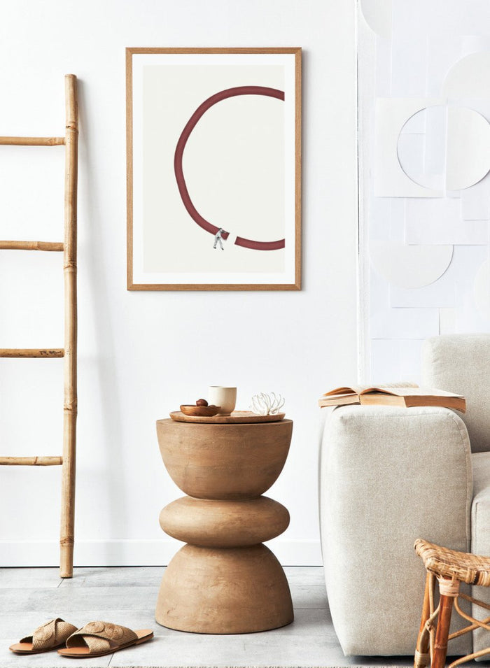 Let’s Reconnect by Maarten Léon is a minimalist collage art print showing a man repairing a broken graphic circle. Premium fine art print with real wood framing.