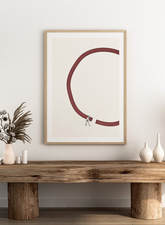 Let’s Reconnect by Maarten Léon is a minimalist collage art print showing a man repairing a broken graphic circle. Premium fine art print with real wood framing.