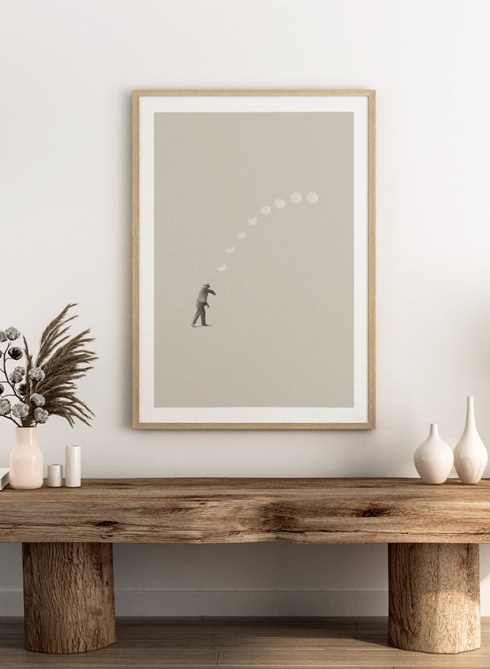 Man throwing the moon across the sky in Lucky Shot by Maarten Léon. Surreal collage wall art, minimalist contemporary poster, premium fine art with real wood frame.