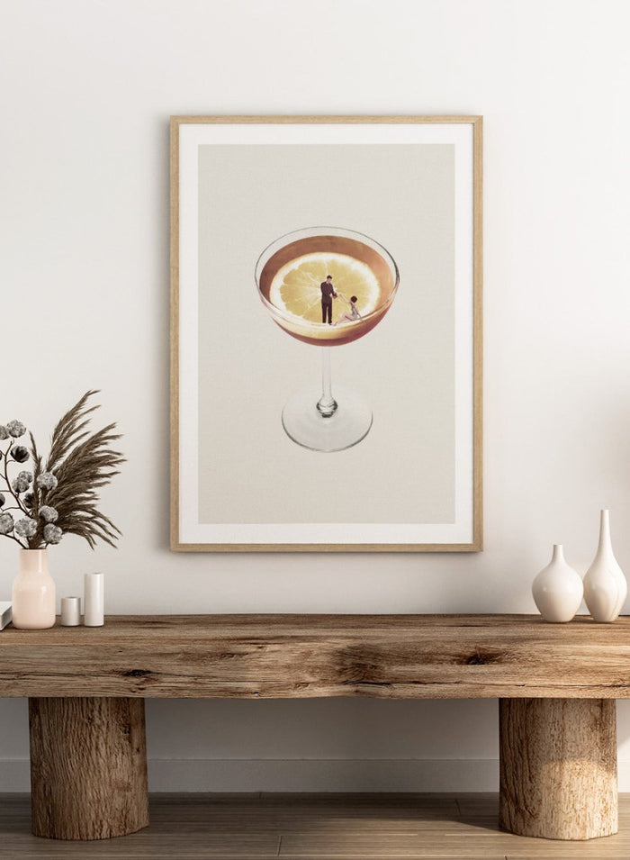 My Drink Needs a Drink by Maarten Léon is a minimalist collage art print featuring a lemon cocktail scene with vintage figures and playful surreal detail.