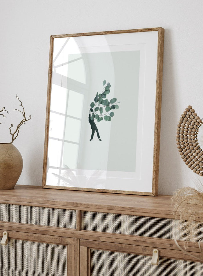 The Extravert by Maarten Léon collage art print showing a figure holding oversized eucalyptus branches. Premium fine art print with real wood framing.