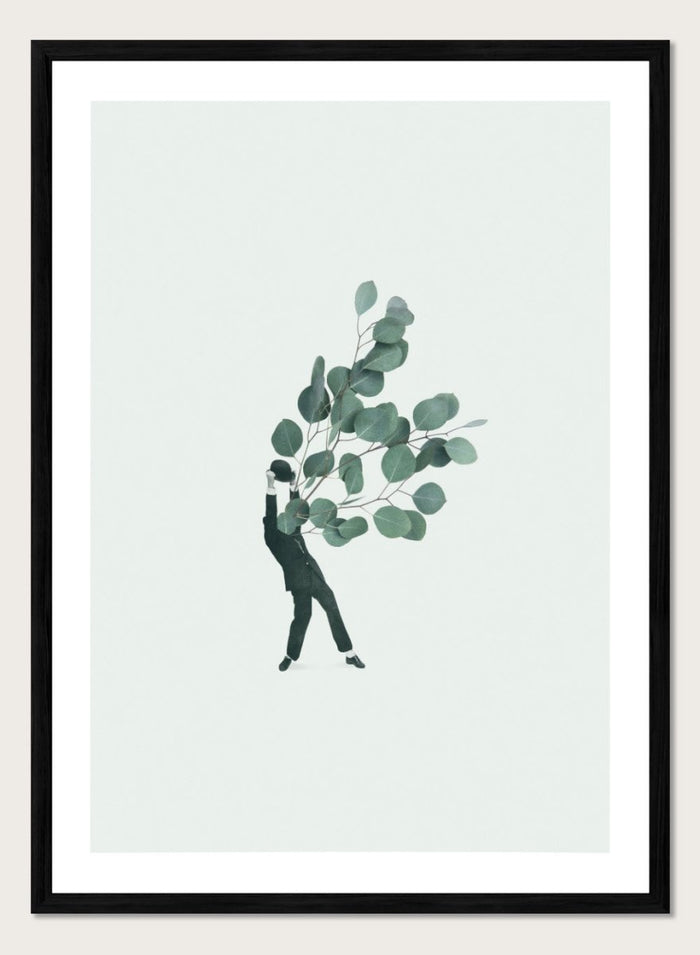 The Extravert by Maarten Léon collage art print showing a figure holding oversized eucalyptus branches. Premium fine art print with real wood framing.