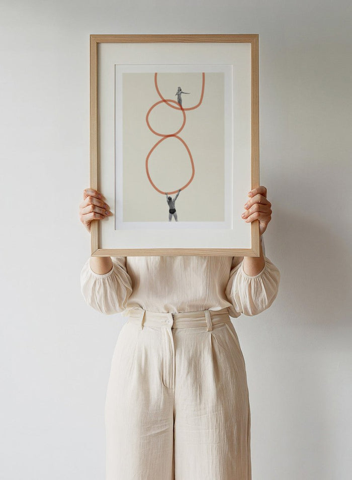 You Make Me Feel Everything by Maarten Léon is a surreal collage art print featuring two figures connected by looping abstract lines. Premium fine art print with real wood framing.