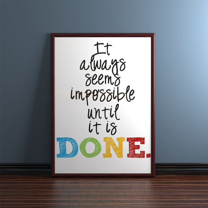 Motivational quote framed in a mahogany picture frame with colorful letters spelling 'DONE'.