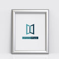 Silver picture and poster frame showcasing Frames Plus logo in a clean and modern design.