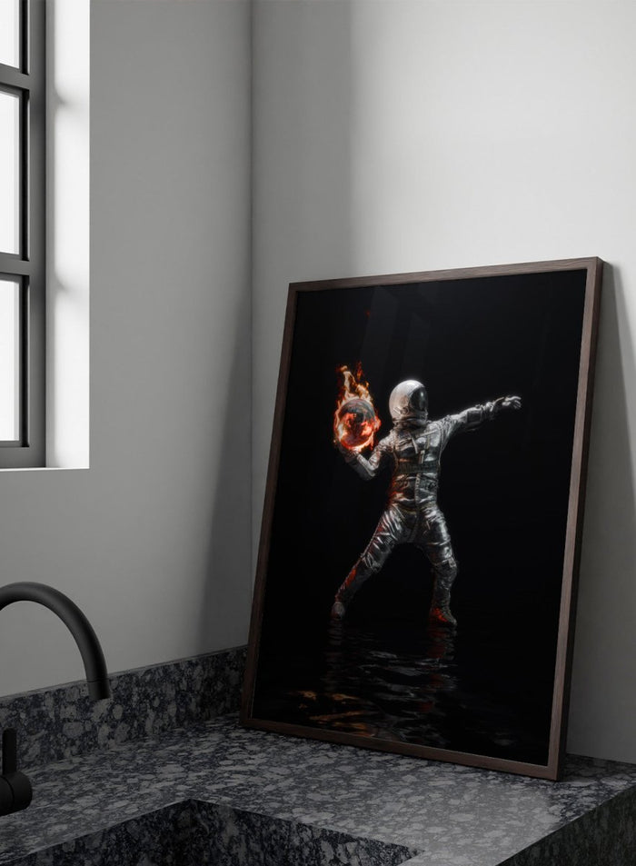 Person in a silver suit holding a flaming sphere against a black background. Astronaut Burning Earth by Nicebleed is a surreal astronaut art print featuring a flaming planet, dark background, and modern sci-fi aesthetic poster design.