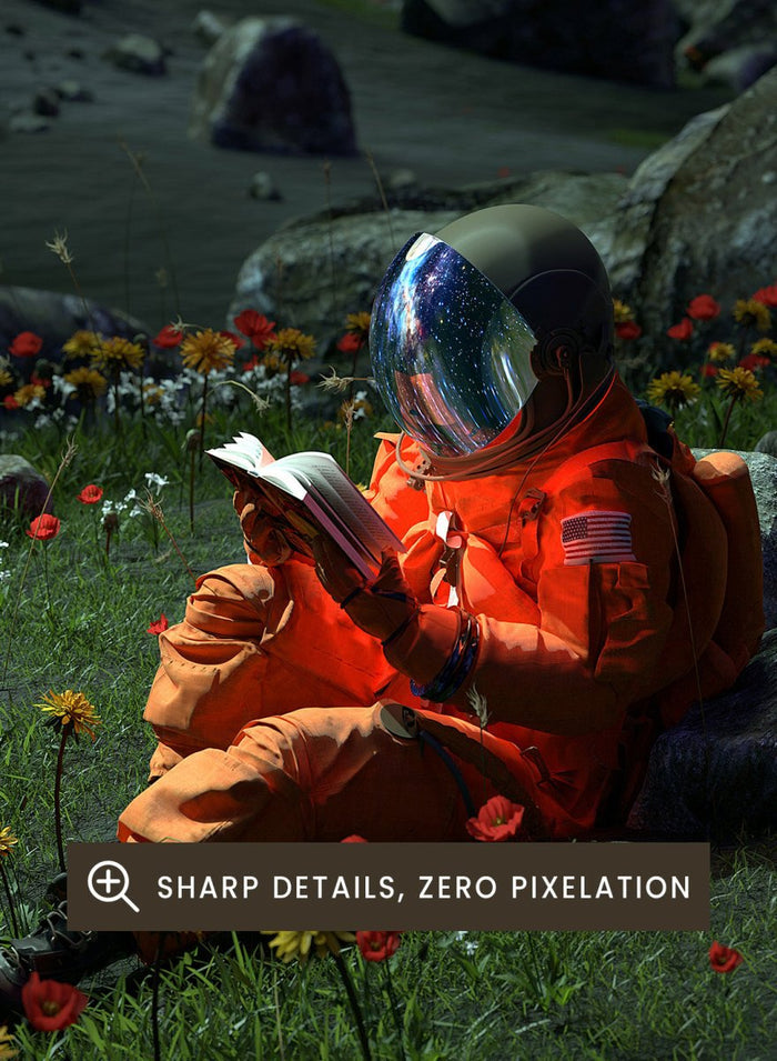 Person in orange spacesuit sitting on the moon reading a book with a large moon and stars in the background. Astronaut’s Alien Garden by Nicebleed is a surreal space art print featuring an astronaut reading in a floral alien landscape, modern aesthetic wall poster.
