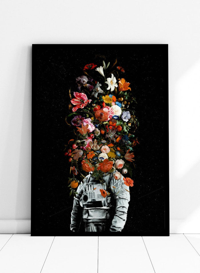 Artistic depiction of a person in astronaut suit with floral elements on a black background. Blooming Astronaut by Nicebleed is a surreal floral space art print featuring an astronaut with a head of flowers, modern aesthetic wall poster.