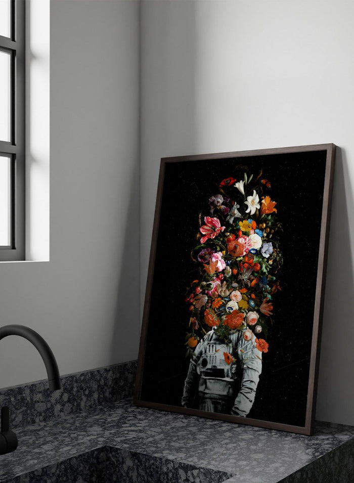 Artistic depiction of a person in astronaut suit with floral elements on a black background. Blooming Astronaut by Nicebleed is a surreal floral space art print featuring an astronaut with a head of flowers, modern aesthetic wall poster.