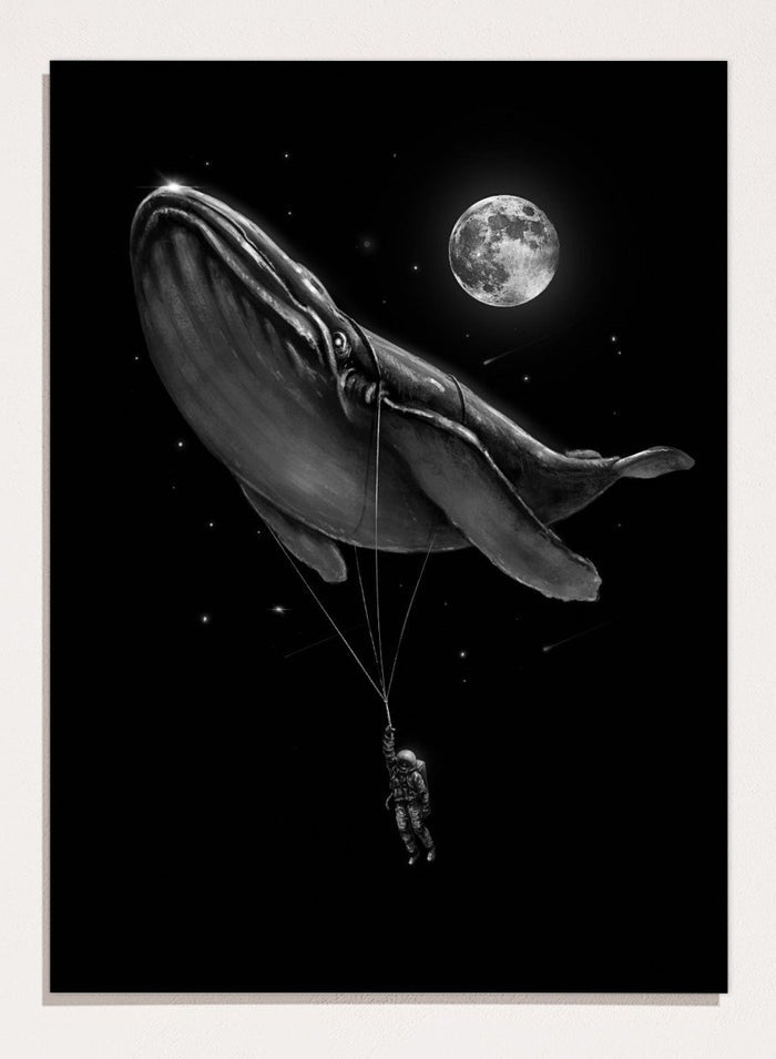 Black and white illustration of a large whale balloon with a person attached, set against a starry night sky with a moon. Cosmic Whale Ride by Nicebleed is a surreal space art print featuring an astronaut hanging from a floating whale, modern aesthetic wall poster.