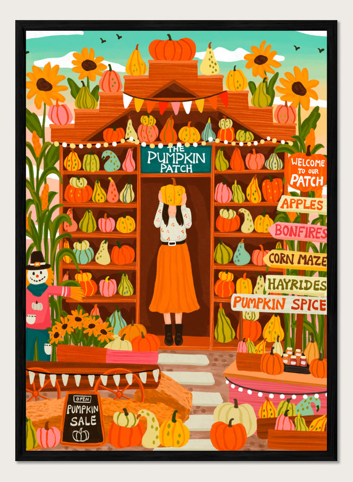 A colorful autumn-themed illustration of a woman standing in the doorway of 'The Pumpkin Patch' market stall, surrounded by shelves of pumpkins and gourds, sunflowers, corn maze signs, and a pumpkin sale chalkboard. Shop Vibrant Pumpkin Patch by Nidhi Kachhadiya, a colorful fall art print featuring pumpkins, gourds, sunflowers, and playful autumn market details.