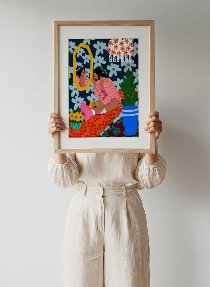 Illustration of a woman applying makeup in front of a mirror with floral patterns and a plant. Before the Mirror by Rafaela Mascaro fine art print poster featuring woman at mirror, bold floral wallpaper, botanical interior, modern contemporary wall art.