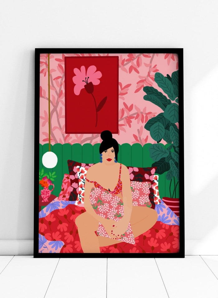 Illustration of a woman in a floral dress sitting on a bed with a colorful room setting. Floral Interior by Rafaela Mascaro is a colorful contemporary art print featuring floral patterns, lush houseplants, vibrant interiors, and joyful home decor inspiration.