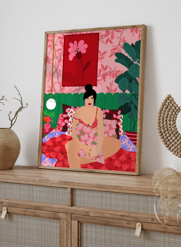 Illustration of a woman in a floral dress sitting on a bed with a colorful room setting. Floral Interior by Rafaela Mascaro is a colorful contemporary art print featuring floral patterns, lush houseplants, vibrant interiors, and joyful home decor inspiration.